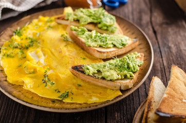 Egg omelette with garlic avocado toast