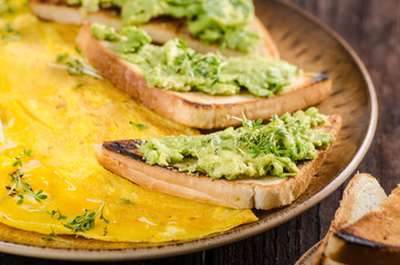Egg omelette with garlic avocado toast