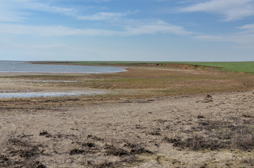 Fototapeta na wymiar coastal beaches and clay bluffs near Manych-Gudilo salt lake Priyutnoye, Kalmykia
