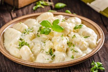 Cheese gnocchi with blue cheese sauce and galic