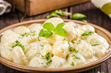 Cheese gnocchi with blue cheese sauce and galic