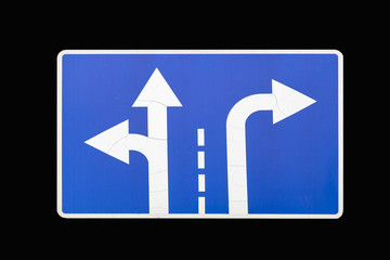 'Direction to be followed' old square blue road sign isolated on black