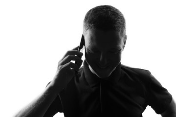 Male person silhouette over white use mobile phone