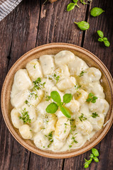 Cheese gnocchi with blue cheese sauce and galic