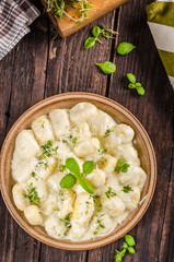 Cheese gnocchi with blue cheese sauce and galic