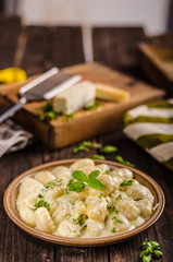 Cheese gnocchi with blue cheese sauce and galic
