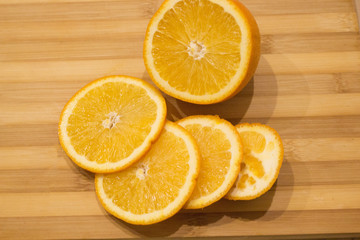 yellow juicy orange closeup on wooden table