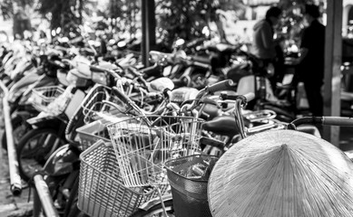 Vietnamese conical hat and bicycles, Vietnam. Black and white