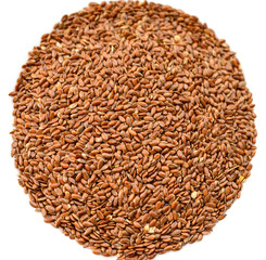 Closeup flax seeds on white background. Selective focus.