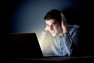Businessman in the office at night