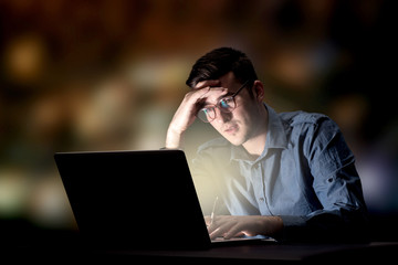 Businessman in the office at night