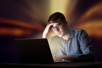 Businessman in the office at night