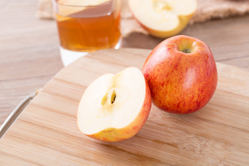 Closeup of apple and apple vinegar.