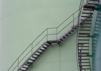 steel ladder around fuel storage tanks