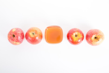 Apple cider vinegar and apple on white background.