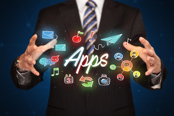 Businessman holding apps