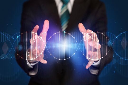 Businessman holding DNA - Powered by Adobe