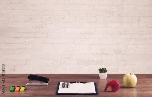 Office Desk Closeup With White Brick Wall Stock Photo And Royalty