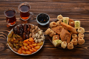 Turkish sweet baklava on plate with Turkish tea. 