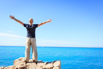 Adult Man Enjoying A Moment Of Freedom By The Sea