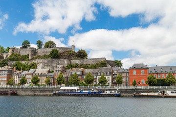 Naklejka premium Citadel fortress and a castle in Namur, Belgium by the Meuse river with ferries