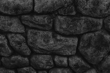 Monochrome Stone wall for background or rocks rough texture