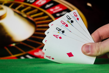 Four of a kind poker cards combination on blurred background casino luck fortune card game