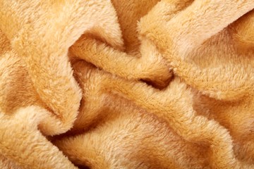 Texture of brown fluffy soft plush. Towel terry cloth, Soft texture cloth