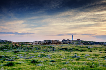 Fototapeta na wymiar Paphos, Cyprus, a beautiful landscape. Lighthouse at sunset