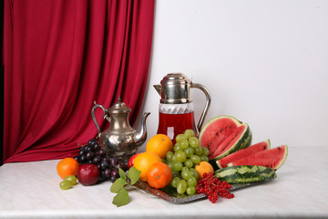 still life fruit objects food utensils pitchers cups composition tasty appetizing fresh white background dutch style