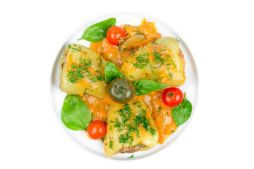 Stuffed peppers with meat, tomatoes and basil on a white plate isolated on white background