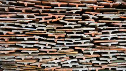 Stone tiles of different shades are stacked in a large pile. Background image. Building material.