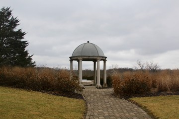 The cement gazebo in the garden in the winter season.