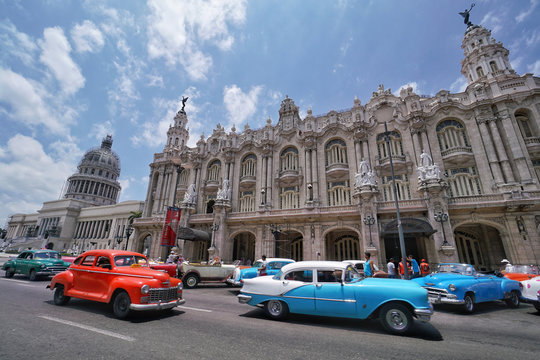 Colorful classic cars in front of the Capitolio in Havana that is capital city of Cuba.