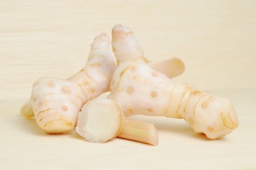 Ginger isolated on wood background