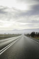 Fototapeta premium Long road on a stormy day