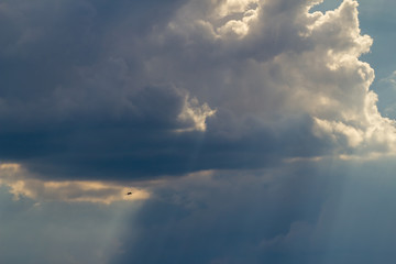 Fototapeta na wymiar airplane in a beautiful cloudy sky