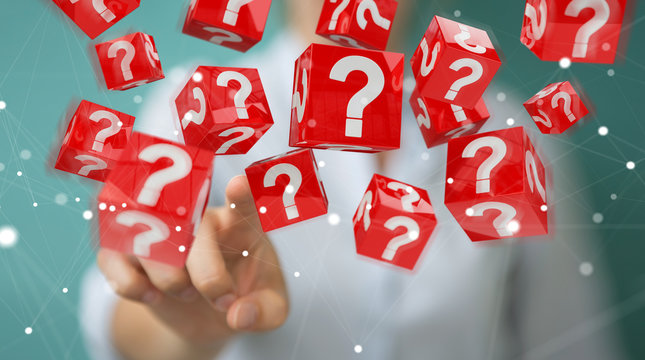 Businesswoman using cubes with 3D rendering question marks