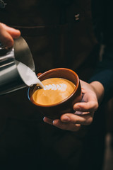 how to make latte art by barista focus in milk and coffee