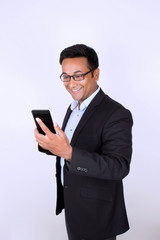 Young man operating smartphone