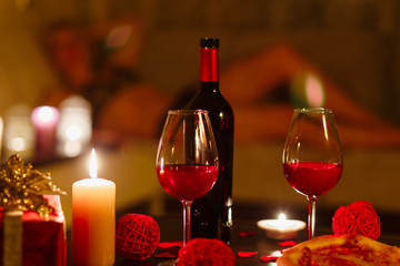 Bottle of red wine and glasses.