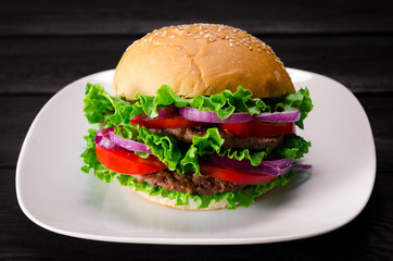 Burger served in bun in nutrition fast food concept