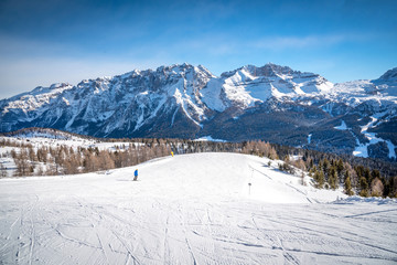 Beautfiul sunny day in the Alps - a skit rack and the mountain