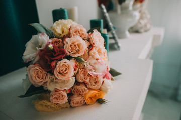 Wedding flowers, bridal bouquet closeup. Decoration made of roses, peonies and decorative plants, close-up, selective focus