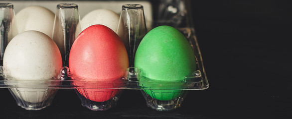 Easter eggs on a dark background (colored eggs - paint)