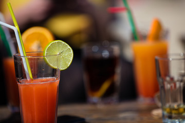 Alcohol orange daiquiri cocktail on beach bar