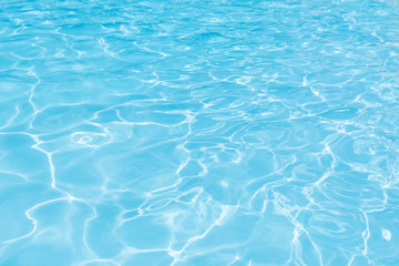 Naklejka na ściany i meble Blue and bright water in swimming pool