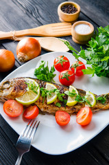 Fried fish served on the plate