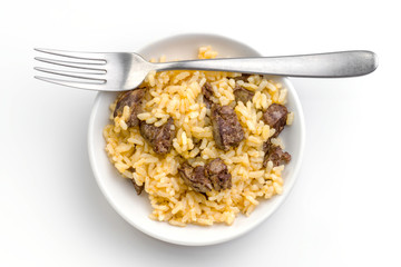 homemade rice ration with metal fork, overhead shot