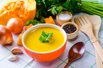 Pumpkin soup served on the table in bowl